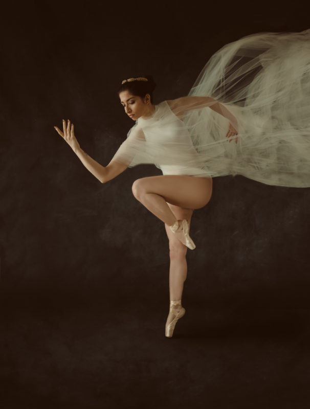 Dancer in flowing white gown, Man in tuxedo, poses for male head shots, featured photographer for sue bryce education